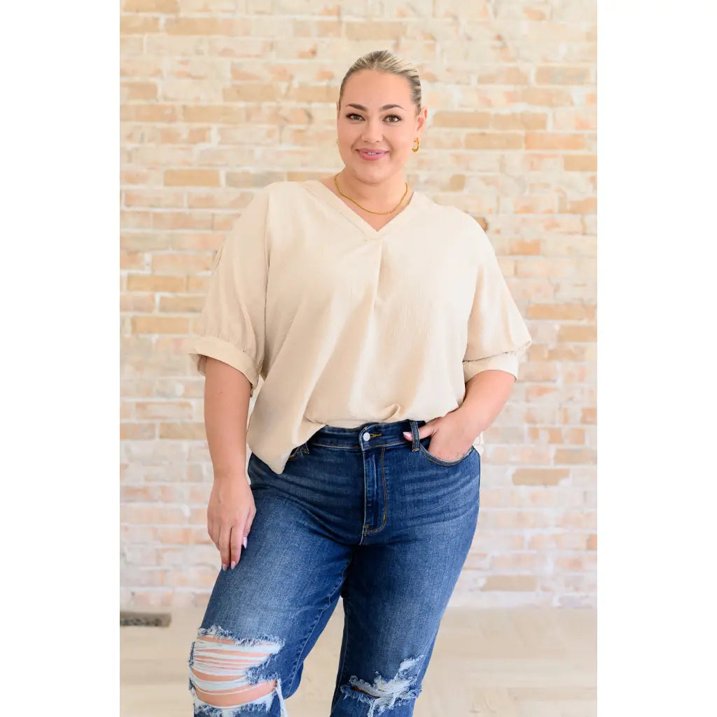 Our Up For Anything V-Neck Blouse in Taupe is a perfect staple piece for any closet! The crinkle woven fabric adds