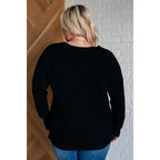 Our V-Neck Front Seam Sweater in black add a stylish touch to your closet! The dropped shoulder and relaxed fit