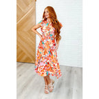 The Vacay Babe Dress features flutter sleeves pockets and a smocked waist—available in plus sizes for the perfect fit