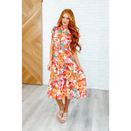 The Vacay Babe Dress features flutter sleeves pockets and a smocked waist—available in plus sizes for the perfect fit