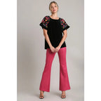 Our Velvet Embroidery Sleeve Blouse in Black is a stunning piece that combines fun look with touch of vintage charm.