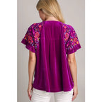 Our Velvet Embroidery Sleeve Blouse in Violet is a stunningly vibrant piece that combines fun look with touch