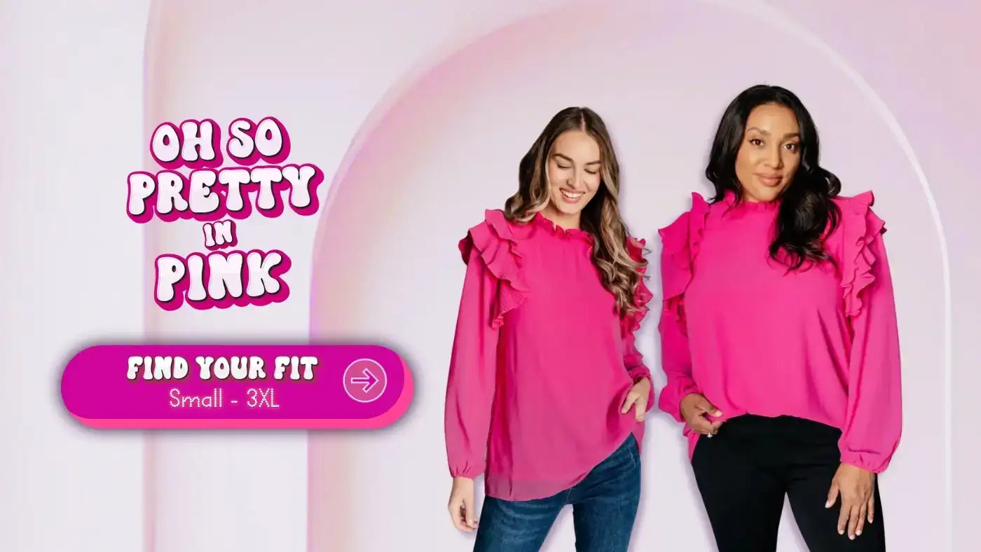 Two women wearing bright pink ruffled blouses, shown side by side to highlight fit across sizes, with a ‘Find Your Fit’ button and size range Small–3XL at SweetRooBou.com