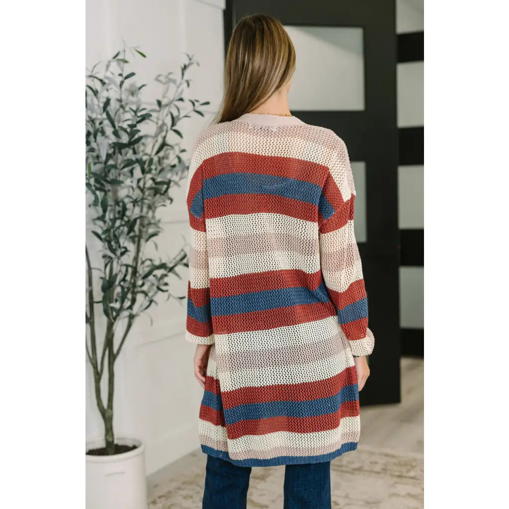 Multicolor striped longline knit cardigan with drop sleeves and open front. Lightweight boutique layering in plus sizes.
