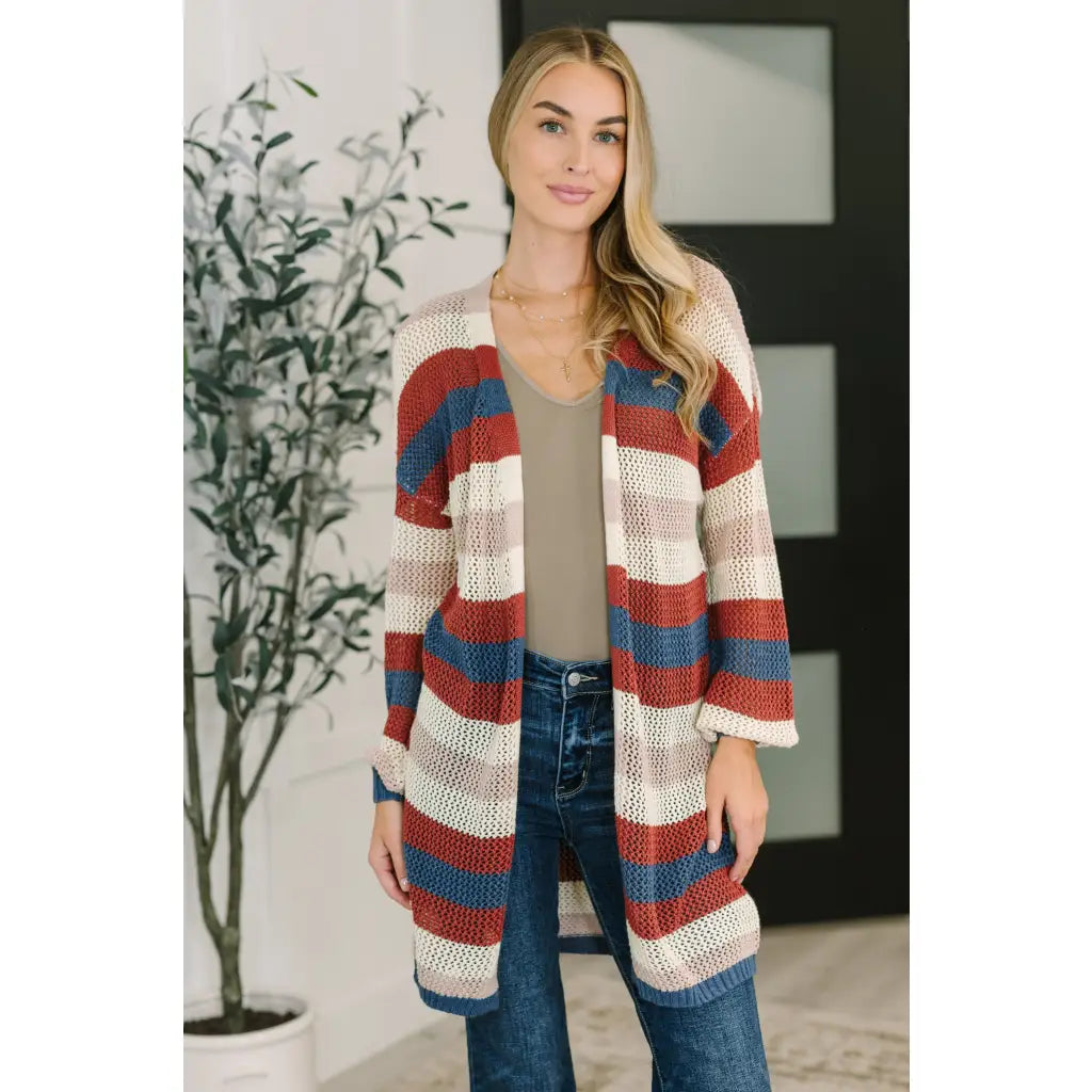 Multicolor striped longline knit cardigan with drop sleeves and open front. Lightweight boutique layering in plus sizes.