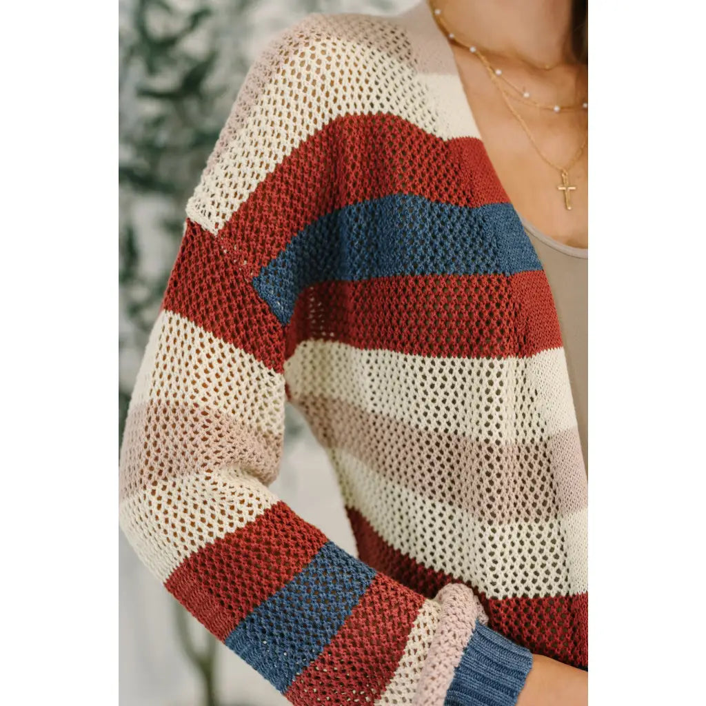 Multicolor striped longline knit cardigan with drop sleeves and open front. Lightweight boutique layering in plus sizes.