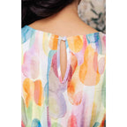 Midi dress with abstract watercolor print sleeves and flattering fit. Available in standard plus size. Spring ready