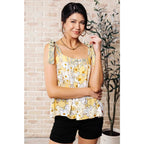 Our What’s Happening Here Yellow Floral Tank is playful and feminine! It features a woven fabric functional shoulder