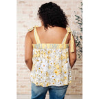 Our What’s Happening Here Yellow Floral Tank is playful and feminine! It features a woven fabric functional shoulder