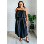 Chic black wide leg jumpsuit with adjustable straps tiered bodice and side pockets. Size inclusive from Small to 3XL