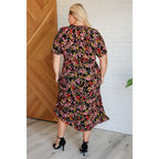 Our Wildflower and Barley V-Neck Button Up Dress is crafted from a stunning black floral printed textured woven fabric.