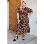 Our Wildflower and Barley V-Neck Button Up Dress is crafted from a stunning black floral printed textured woven fabric.