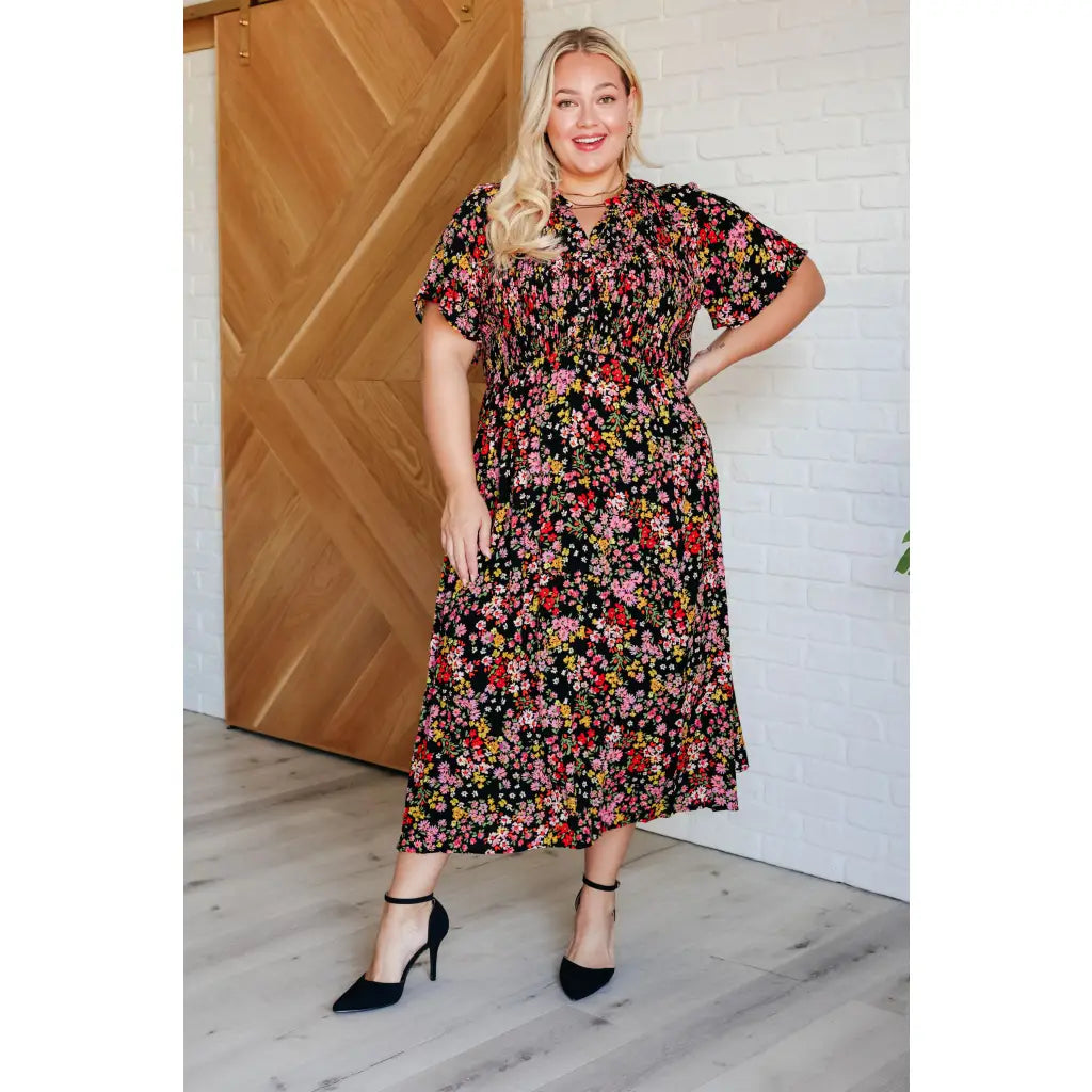 Our Wildflower and Barley V-Neck Button Up Dress is crafted from a stunning black floral printed textured woven fabric.