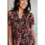 Our Wildflower and Barley V-Neck Button Up Dress is crafted from a stunning black floral printed textured woven fabric.