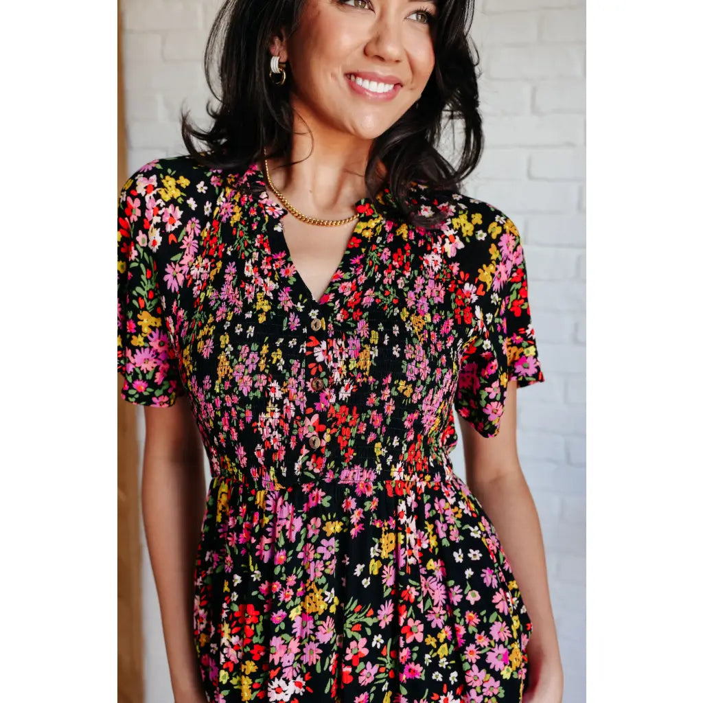 Our Wildflower and Barley V-Neck Button Up Dress is crafted from a stunning black floral printed textured woven fabric.