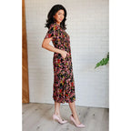 Our Wildflower and Barley V-Neck Button Up Dress is crafted from a stunning black floral printed textured woven fabric.