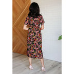 Our Wildflower and Barley V-Neck Button Up Dress is crafted from a stunning black floral printed textured woven fabric.