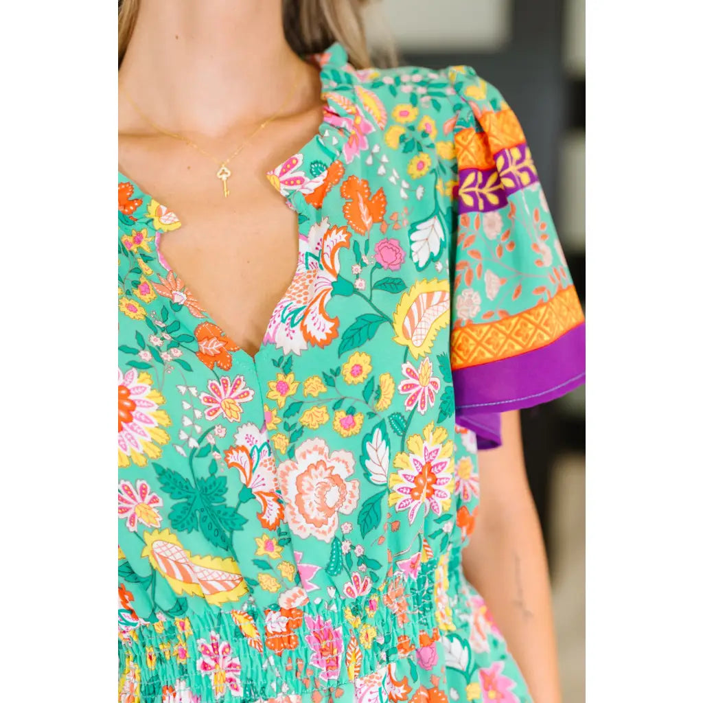 Brighten your wardrobe with the Mint to Be Flutter Dress — bold florals mint green base and plus size friendly. Style