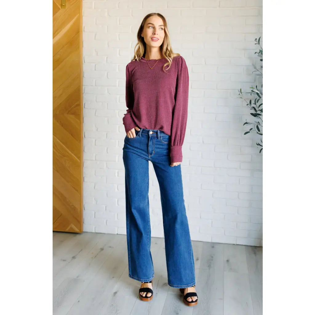 Get cozy in our Wine Down Ribbed Knit Top! The round neckline and gathered shoulder details add a touch of flirty charm