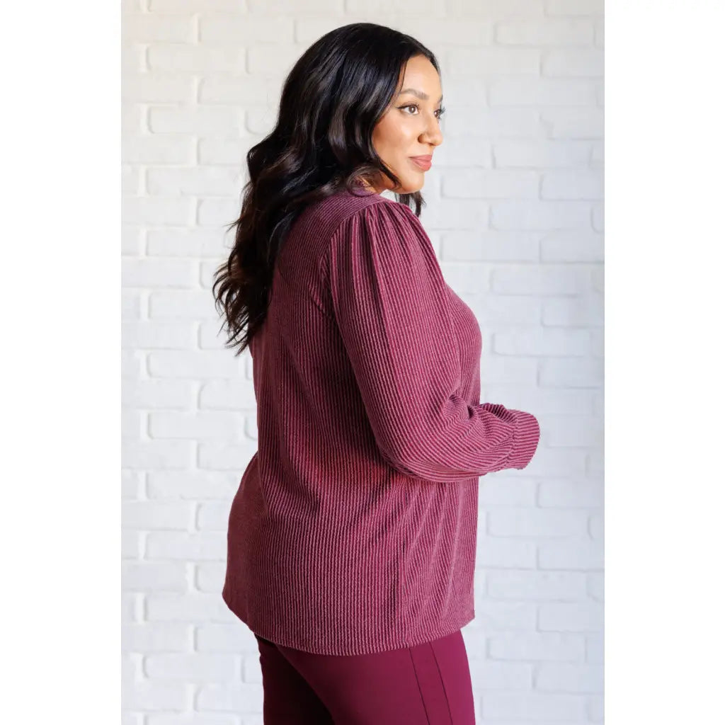 Get cozy in our Wine Down Ribbed Knit Top! The round neckline and gathered shoulder details add a touch of flirty charm