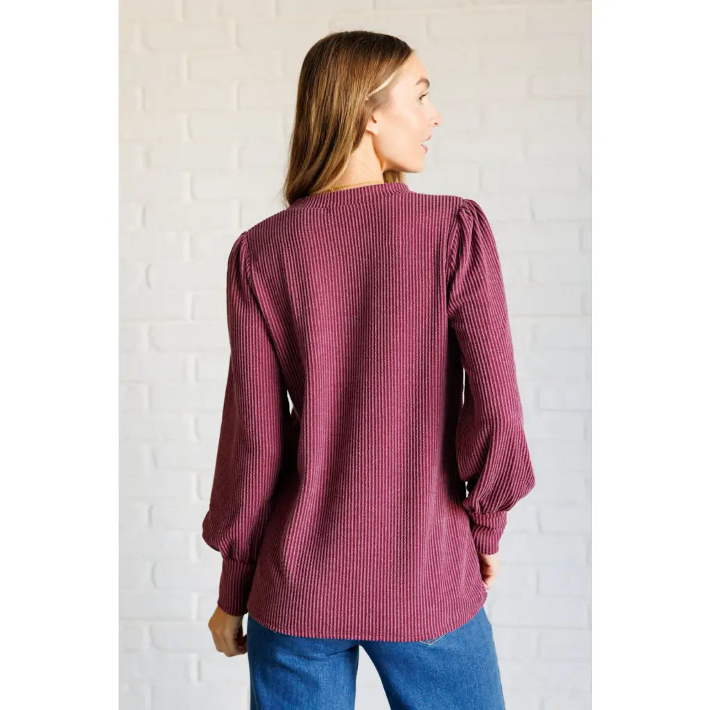 Get cozy in our Wine Down Ribbed Knit Top! The round neckline and gathered shoulder details add a touch of flirty charm