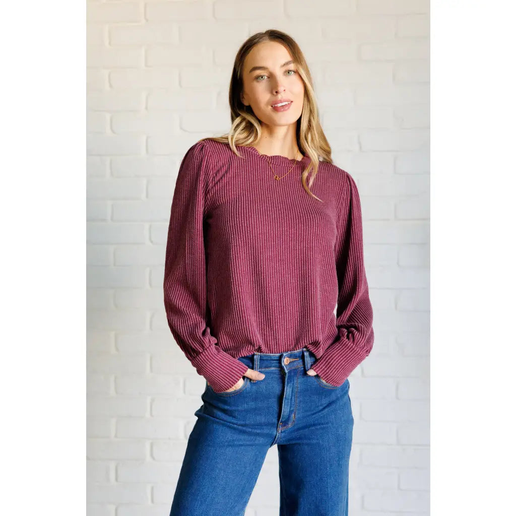 Get cozy in our Wine Down Ribbed Knit Top! The round neckline and gathered shoulder details add a touch of flirty charm