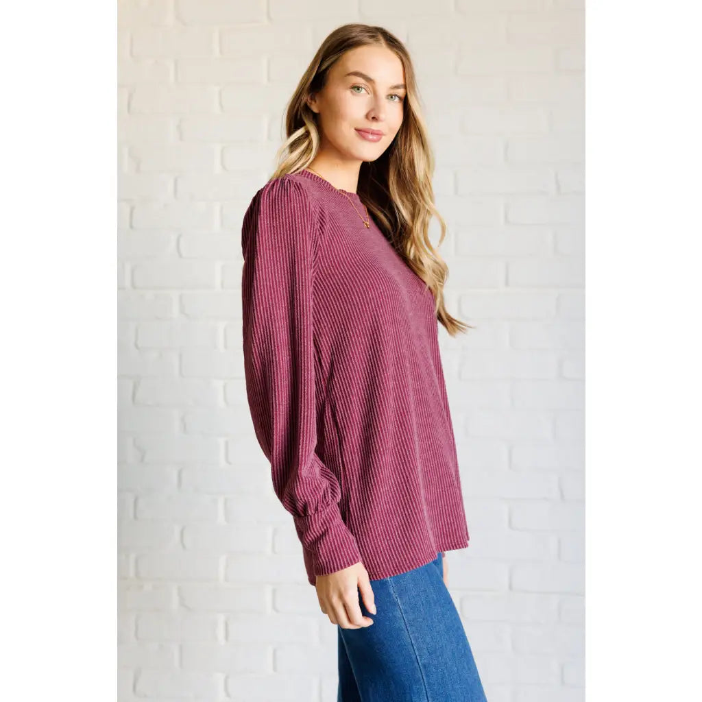 Get cozy in our Wine Down Ribbed Knit Top! The round neckline and gathered shoulder details add a touch of flirty charm