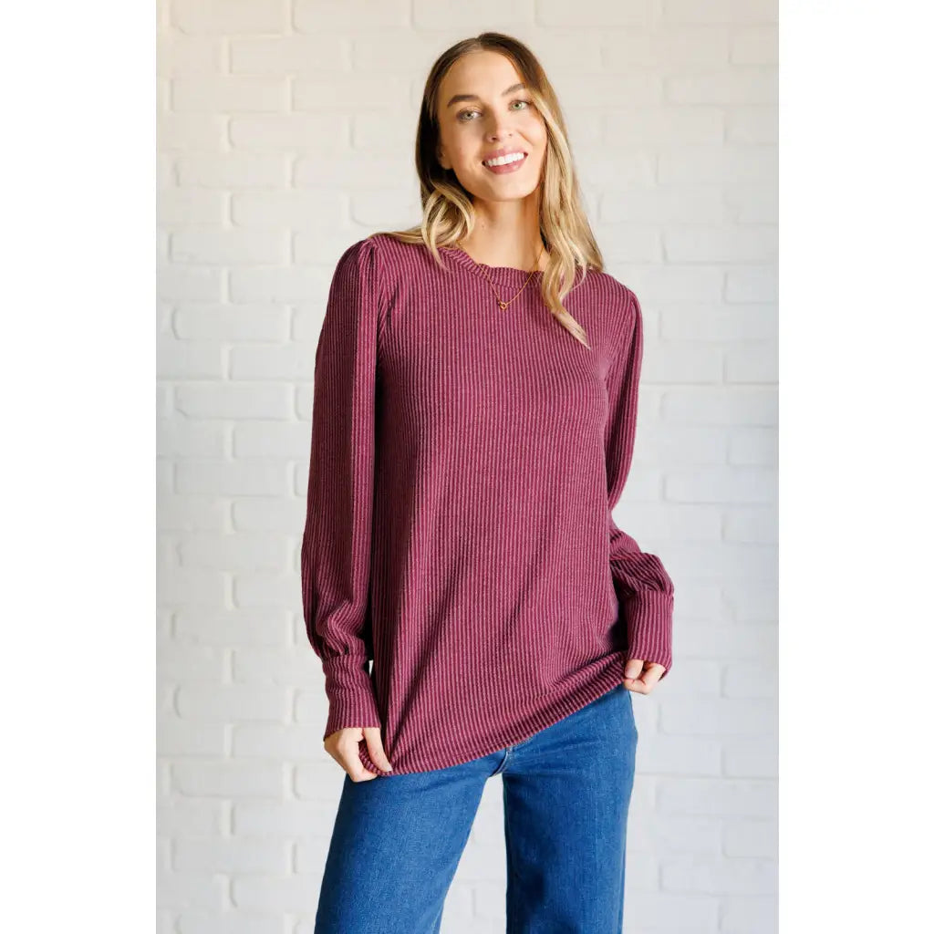 Get cozy in our Wine Down Ribbed Knit Top! The round neckline and gathered shoulder details add a touch of flirty charm