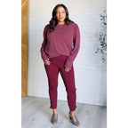 Get cozy in our Wine Down Ribbed Knit Top! The round neckline and gathered shoulder details add a touch of flirty charm