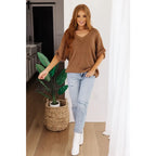 Our comfy oversized Wonder Why Oversized Short Sleeve Sweater is constructed with a lightweight caramel mocha knit