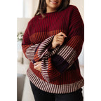 Stay cozy this season in our Wonderful World Striped Sweater. Featuring an oversized fit crew neckline dropped