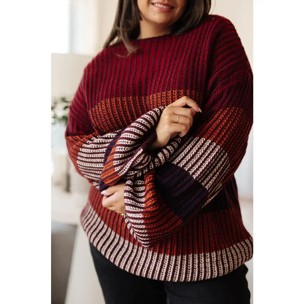 Stay cozy this season in our Wonderful World Striped Sweater. Featuring an oversized fit crew neckline dropped