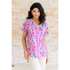 Our Yours Truly V-Neck Top in Magenta features woven fabric is lightweight and perfect for warm weather! The dolman