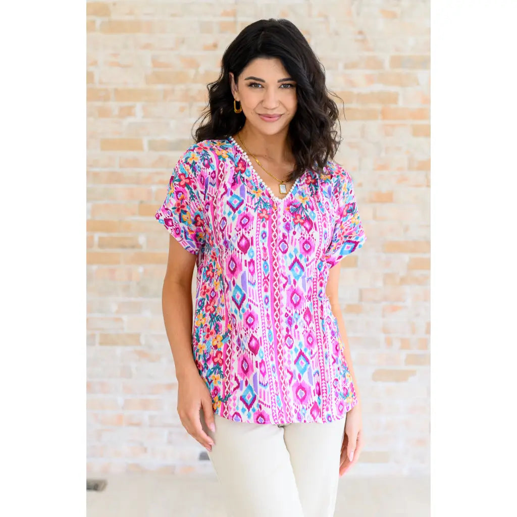 Our Yours Truly V-Neck Top in Magenta features woven fabric is lightweight and perfect for warm weather! The dolman