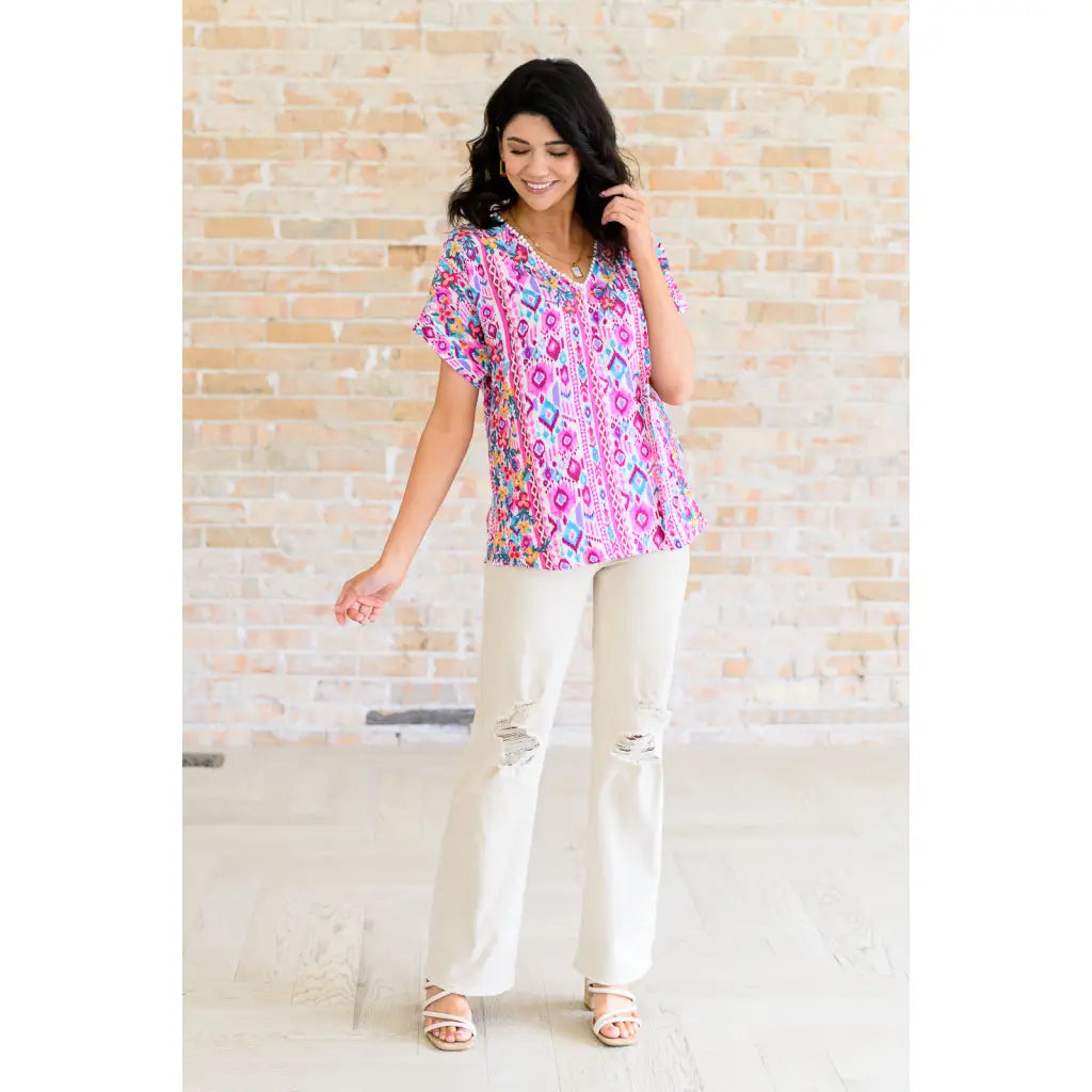 Our Yours Truly V-Neck Top in Magenta features woven fabric is lightweight and perfect for warm weather! The dolman