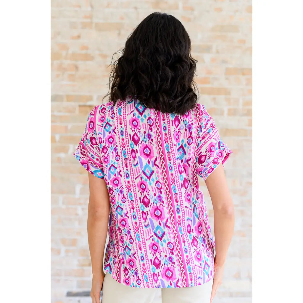 Our Yours Truly V-Neck Top in Magenta features woven fabric is lightweight and perfect for warm weather! The dolman