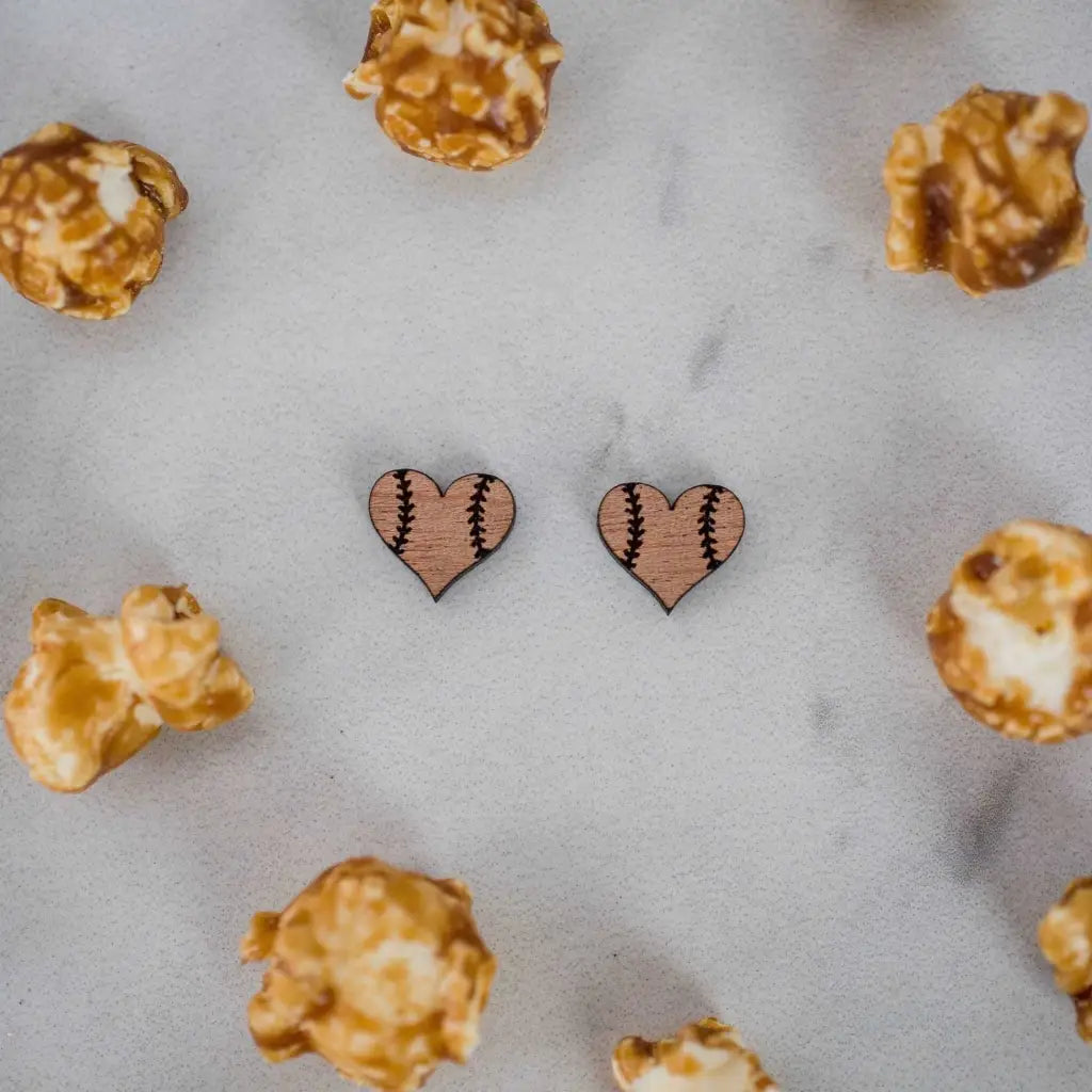 Hand drawn laser cut and engraved baseball/softball heart wood studs. Great for sensitive ears! 13mm x 14mm Material: