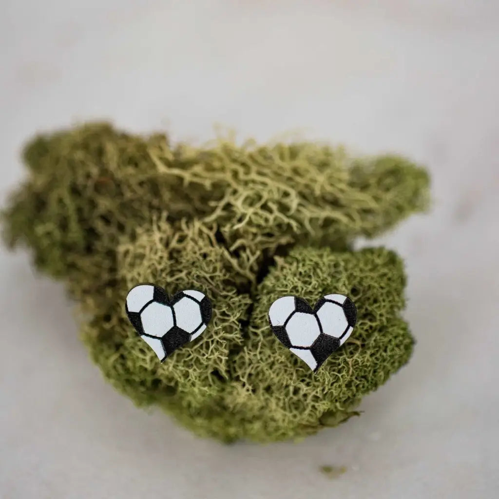 Hand drawn laser cut and engraved soccer acrylic heart studs. Great for sensitive ears! 13mm x 14mm Material: Specialty