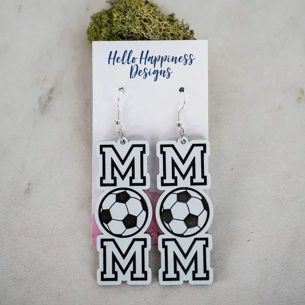 Black & white soccer mom dangle earrings. 2.5 inch length. Great for sensitive ears! Material: Specialty