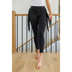 Rock the look in our Hilary Side Fringe Black Skinny Jeggings by Judy Blue! These stretchy denim jeggings feature a mid