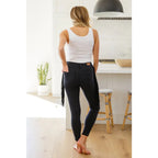 Rock the look in our Hilary Side Fringe Black Skinny Jeggings by Judy Blue! These stretchy denim jeggings feature a mid