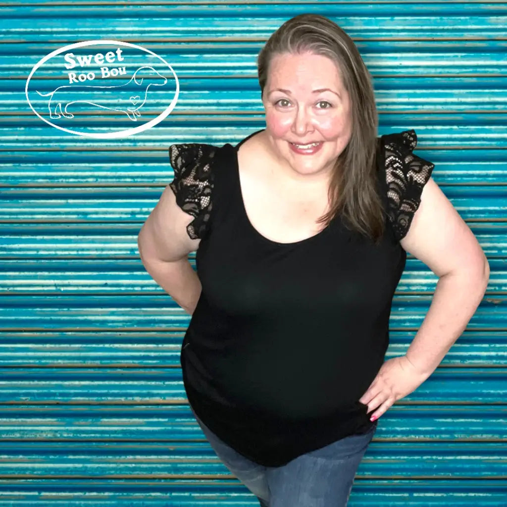 Truly a statement lace top! Features cap sleeves and T back! Perfect for any summer event like an outdoor concert date