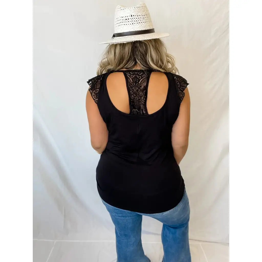 Truly a statement lace top! Features cap sleeves and T back! Perfect for any summer event like an outdoor concert date