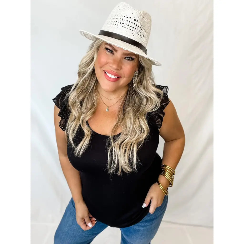 Truly a statement lace top! Features cap sleeves and T back! Perfect for any summer event like an outdoor concert date