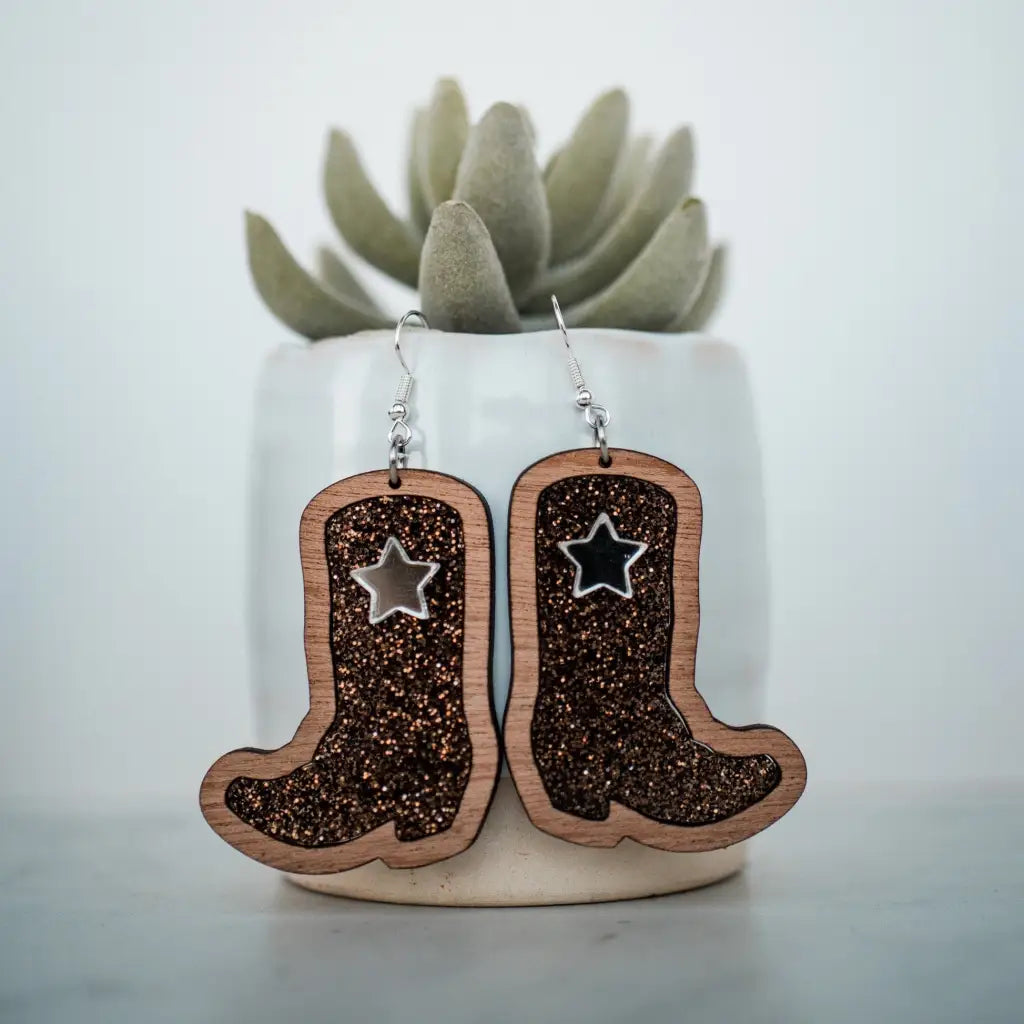 2 inch length Features 3 dimensional star detail Great for sensitive ears Material: Sapele Glitter Acrylic or Patterned