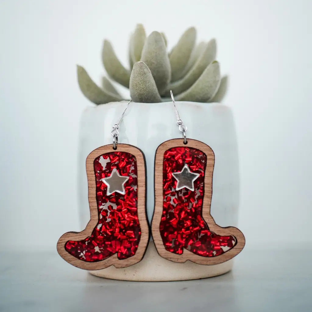 2 inch length Features 3 dimensional star detail Great for sensitive ears Material: Sapele Glitter Acrylic or Patterned