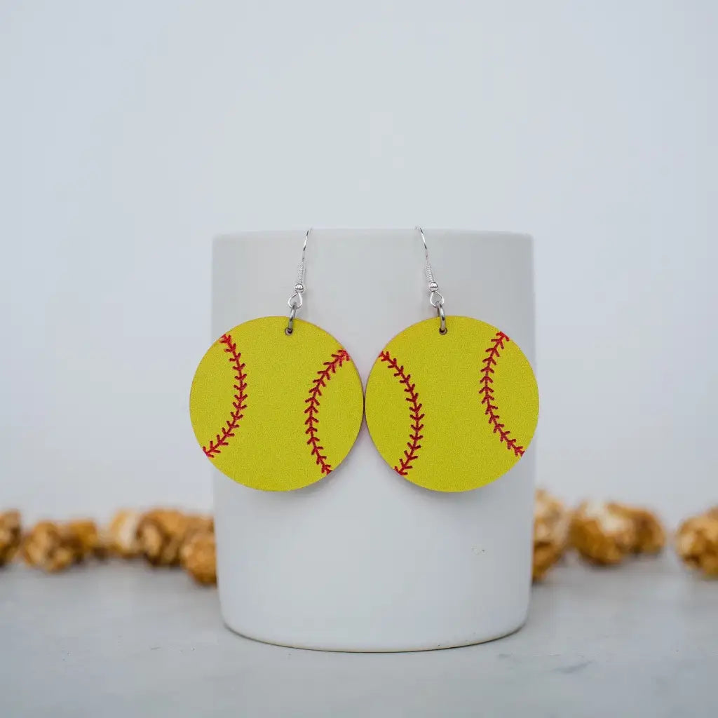 Yellow and red softball acrylic dangle earrings. 1.5 inch length. Great for sensitive ears! Material: Specialty