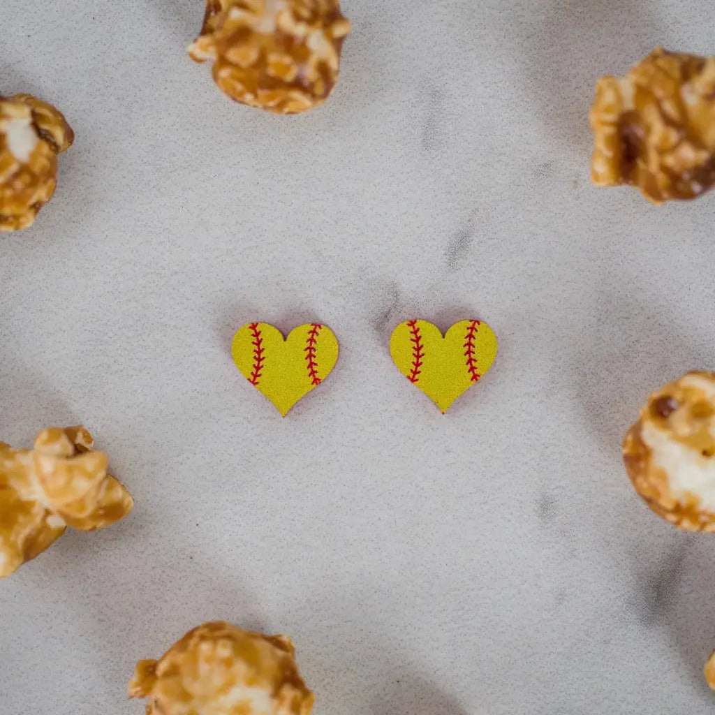 Hand drawn laser cut and engraved yellow red softball heart acrylic studs. Great for sensitive ears! 13mm x 14mm