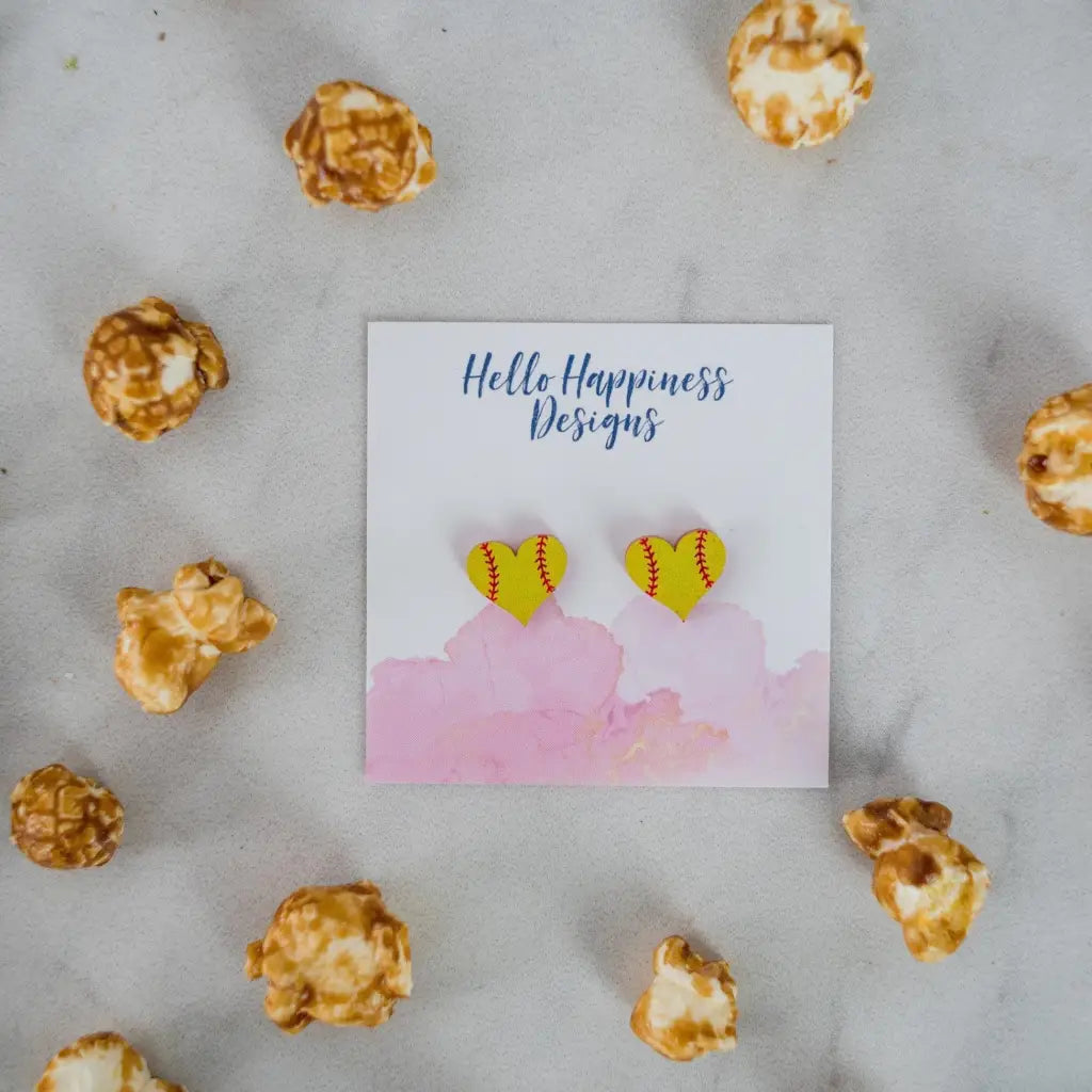 Hand drawn laser cut and engraved yellow red softball heart acrylic studs. Great for sensitive ears! 13mm x 14mm